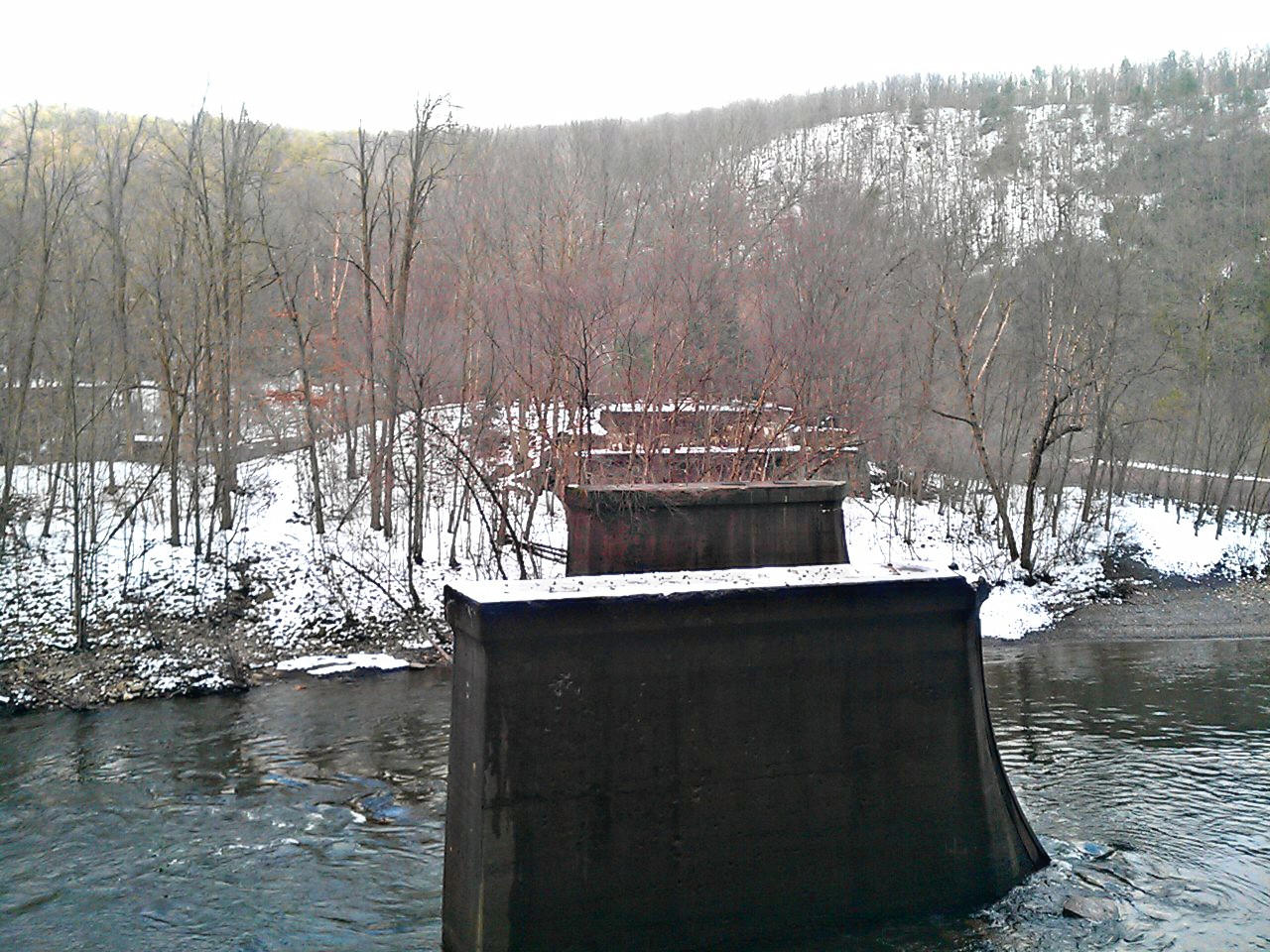 Through the opening of a tunnel in Jim Thorpe, PA, where trains once passed through. You can see the platforms where the tracks once were. 2012